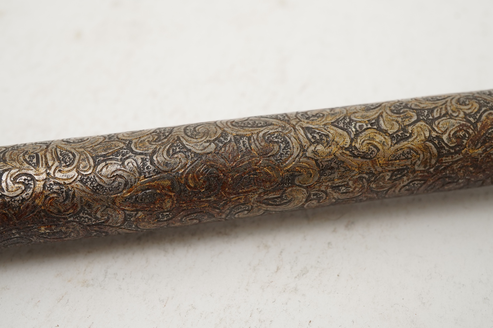 A Tibetan damascened iron scroll holder, 17th century